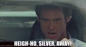 Man driving a car with the text 'Heigh-ho, Silver, away!' displayed, referencing a famous line from The Lone Ranger.